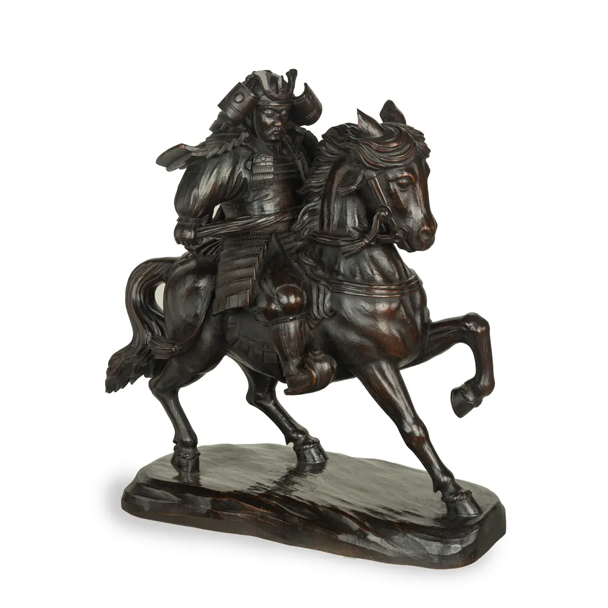 A powerful Japanese equestrian wood carving of a samurai by Yoshida
