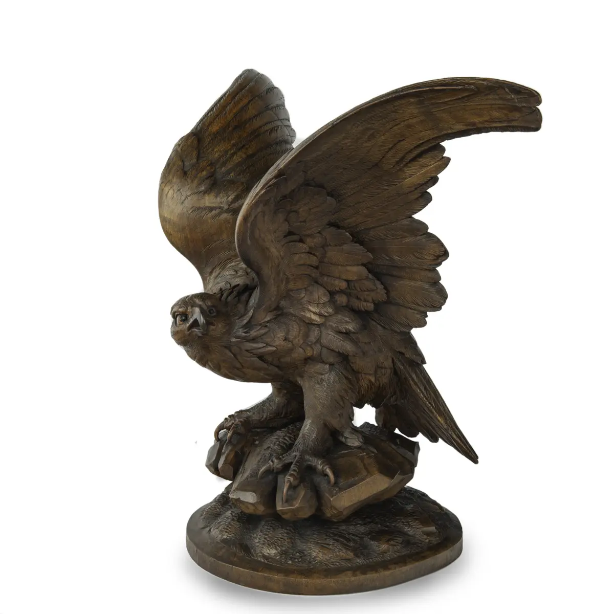 A large Black Forest walnut wooden carving of an eagle