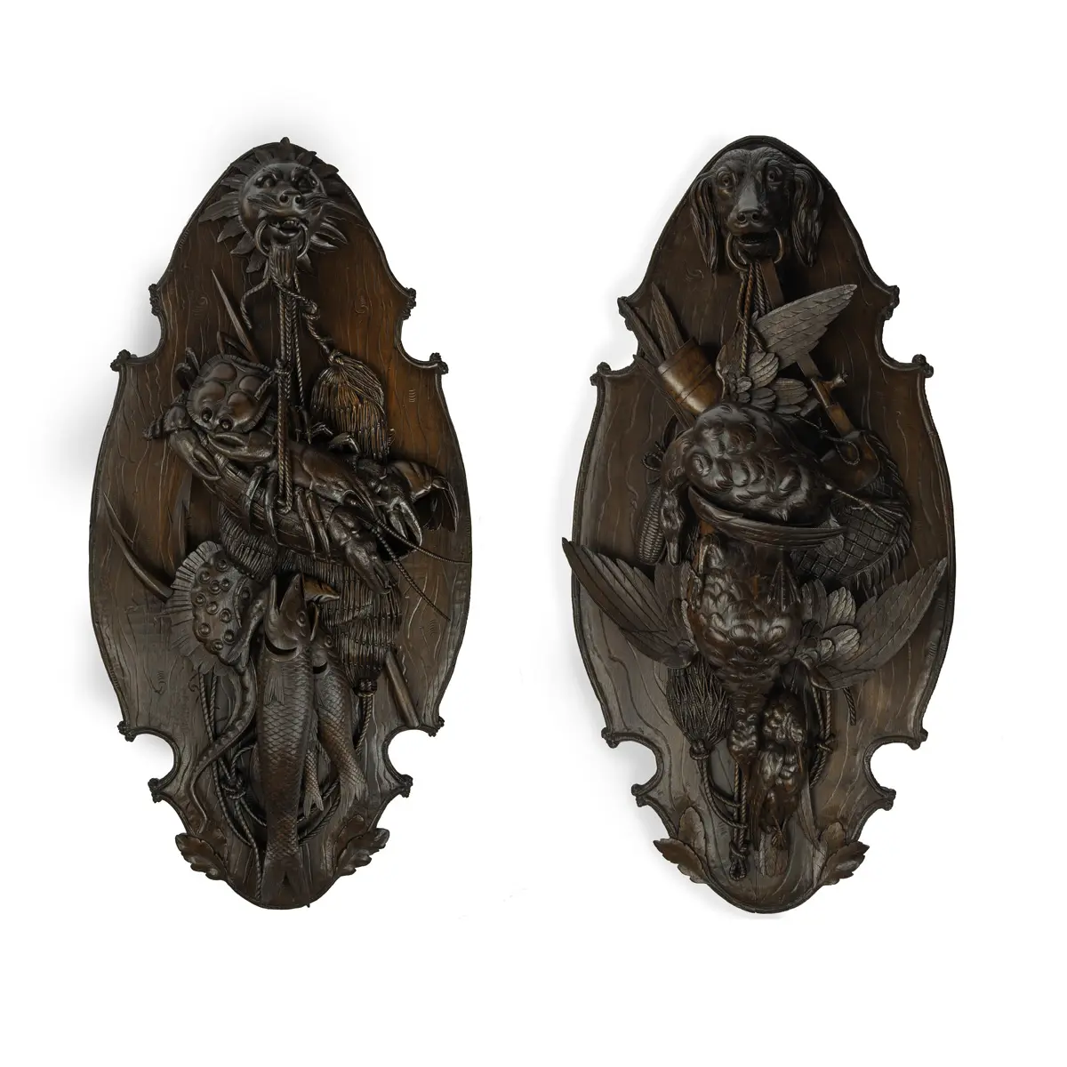 A very fine pair of ‘Black Forest’ walnut game plaques