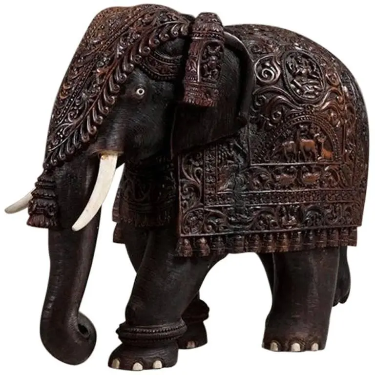 Indian carved hardwood elephant with bone tusks and toe nails