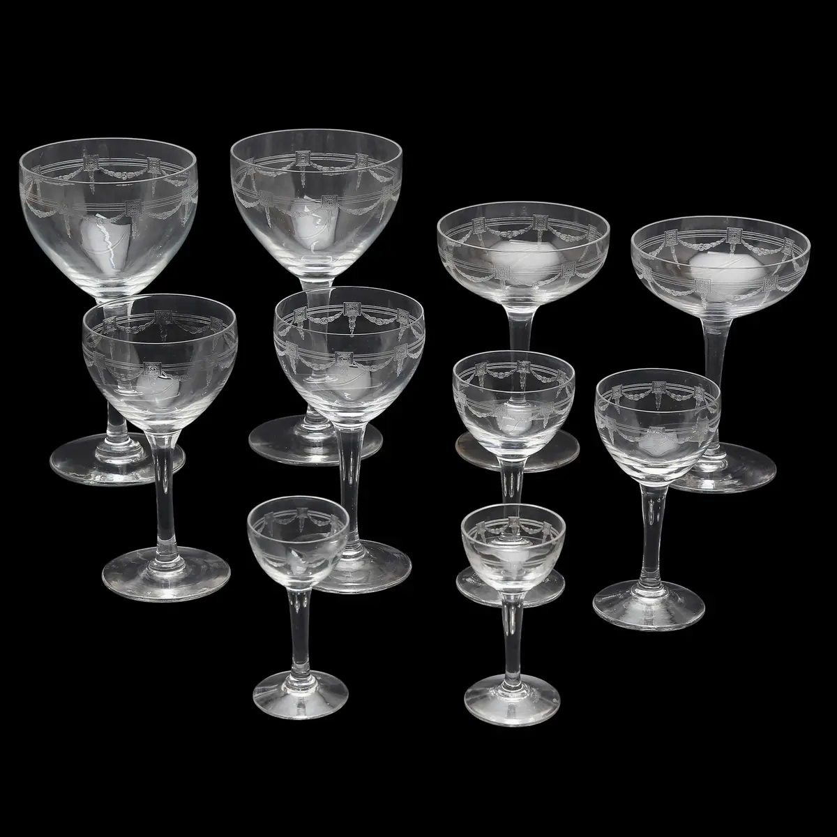 Sixteen-service glassware set in Baccarat "guilloché" crystal, late