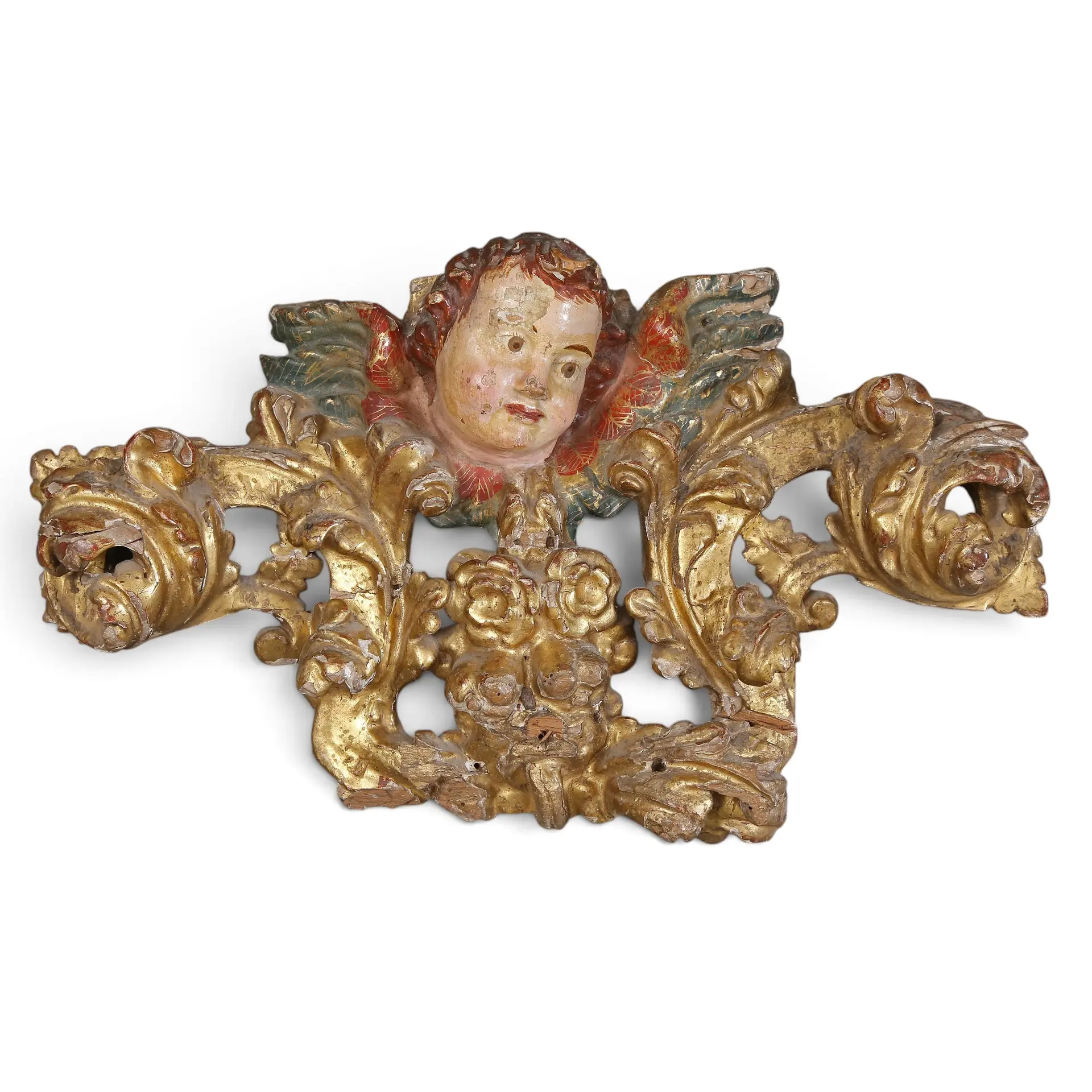 SPANISH SCHOOL, 18TH CENTURY. Cherub head with scrolls and foliage.