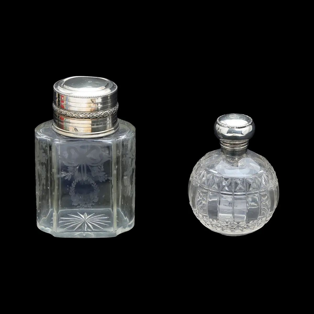 Two toilet perfume jars in silver and acid-etched carved glass, early