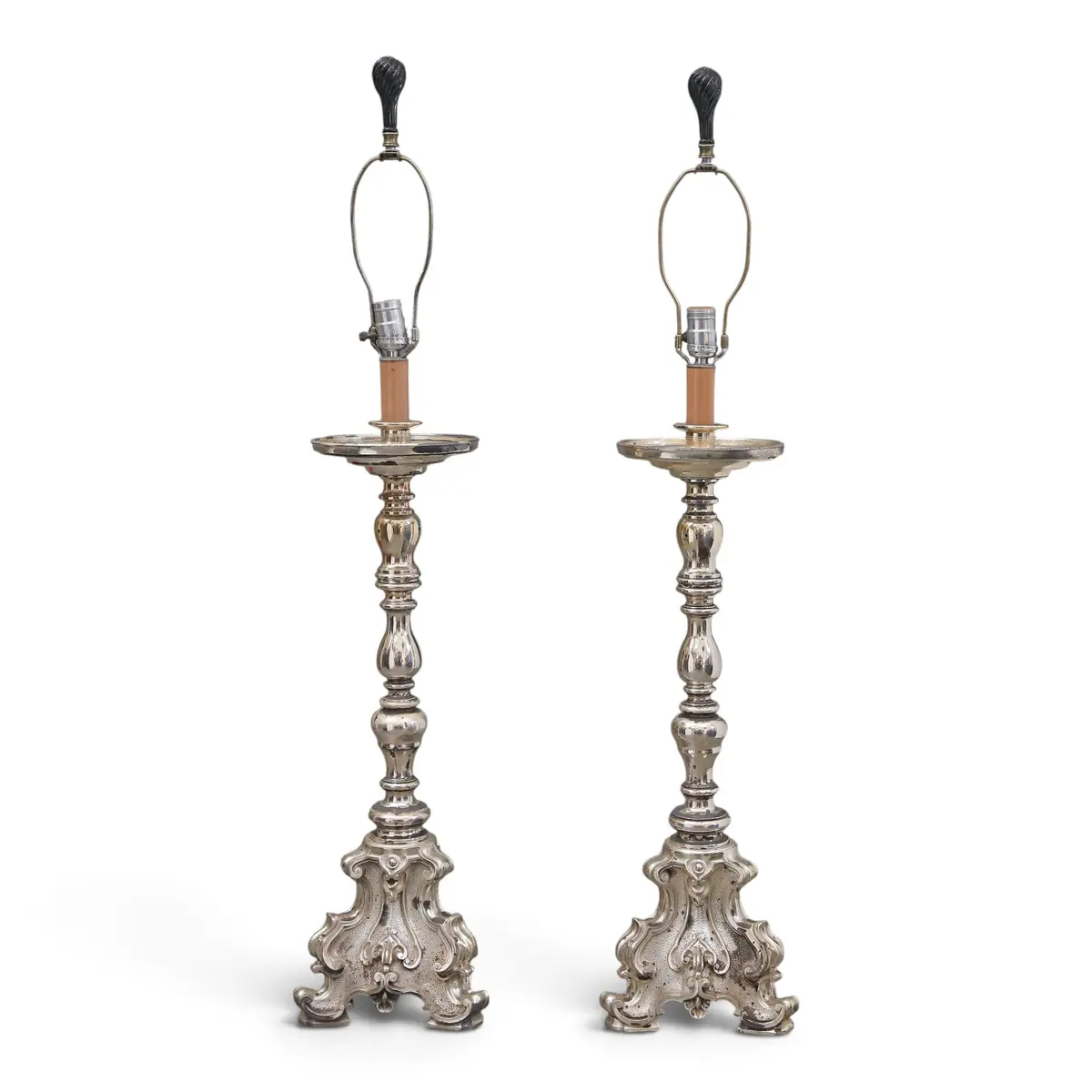 Pair of Baroque-style torch holders-lamps in silvery metal, 20th Century.