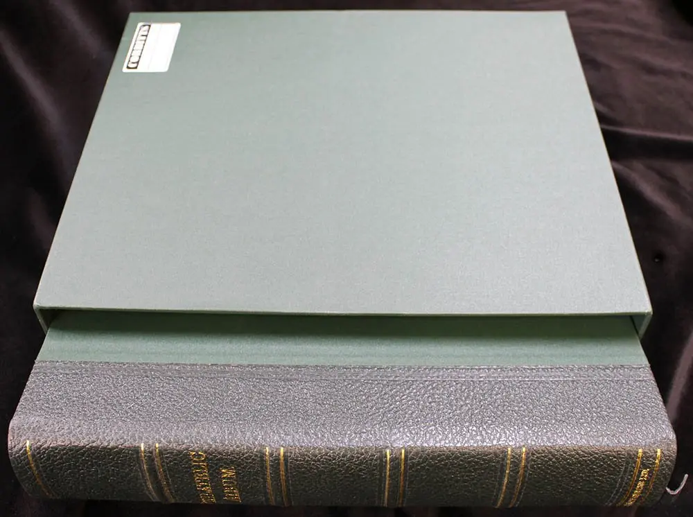 PHILATELIC ALBUM (large green album with slip case)...