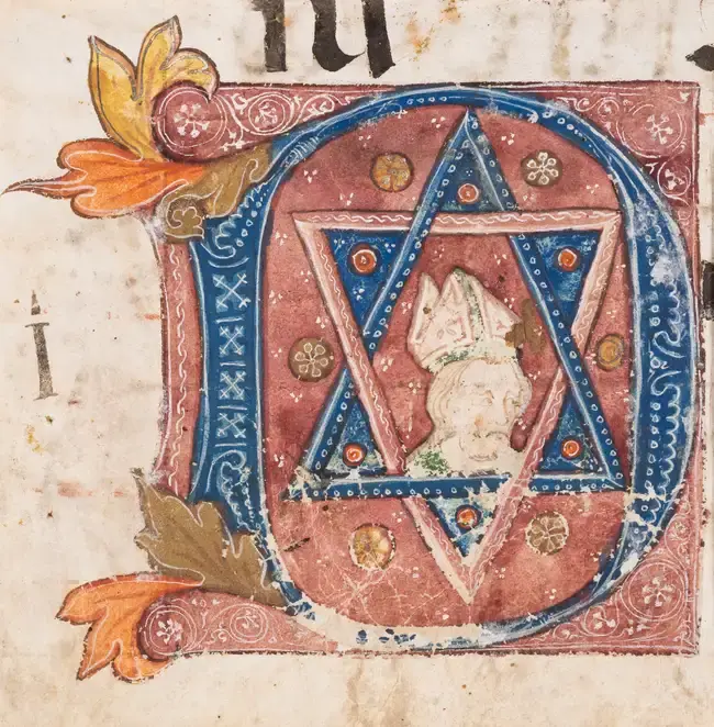 Large initial enclosing the bust of a bishop (perhaps a saint-bishop)