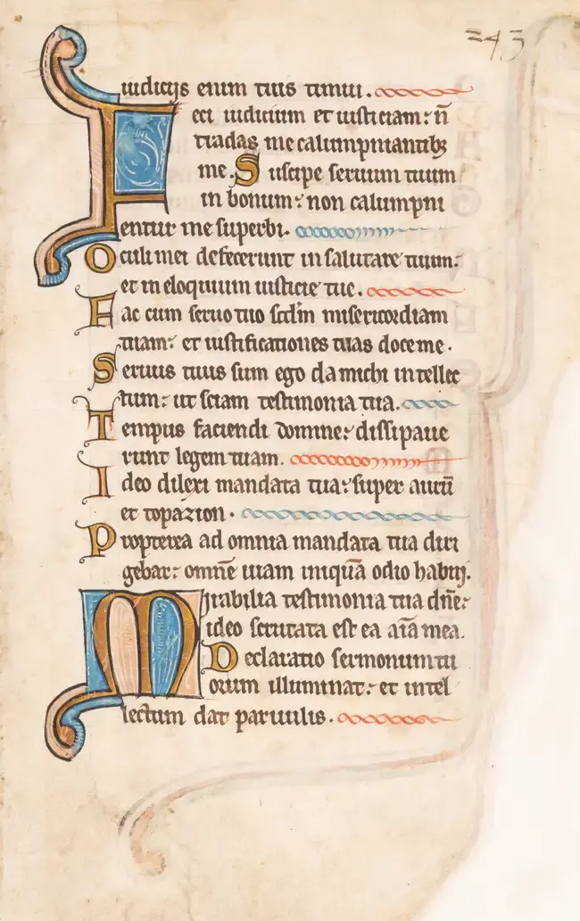 Leaf from a large Psalter with elegantly looping initials, in Latin