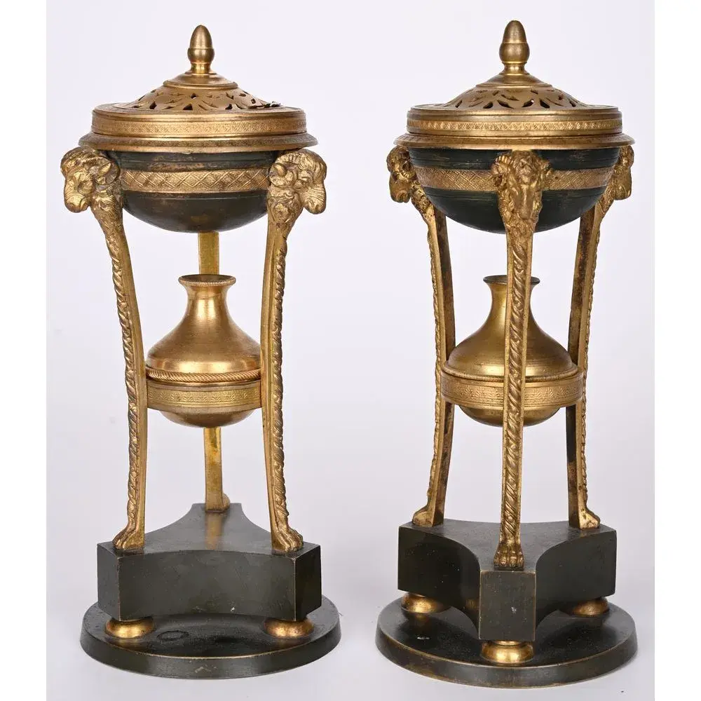 PAIR OF LOUIS XVI INCENSE BURNERS in gilded bronze with a patina.