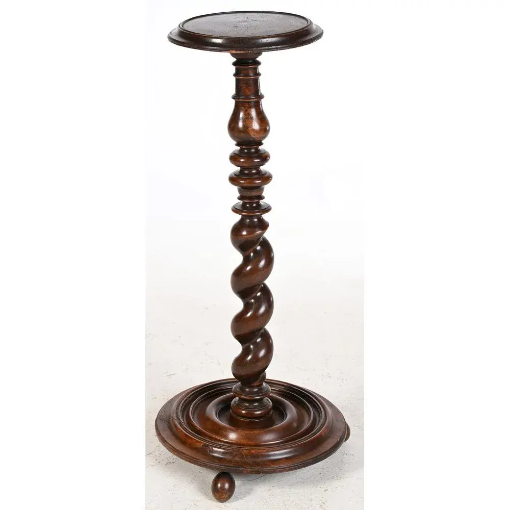 LOUIS XIII STOOL with a round base resting on small ball-shaped legs.