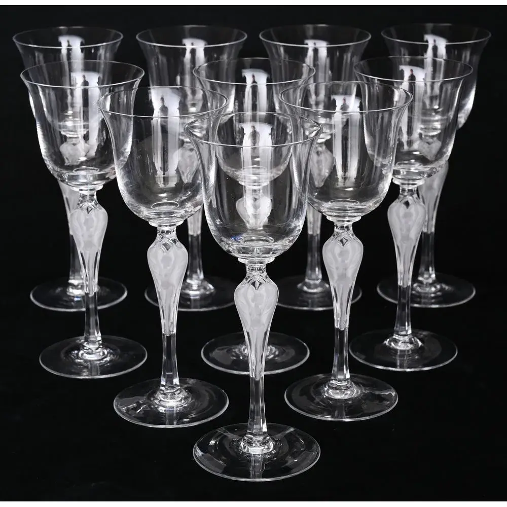FABERGE. SET OF 10 crystal glasses with round bases. The stem is engraved