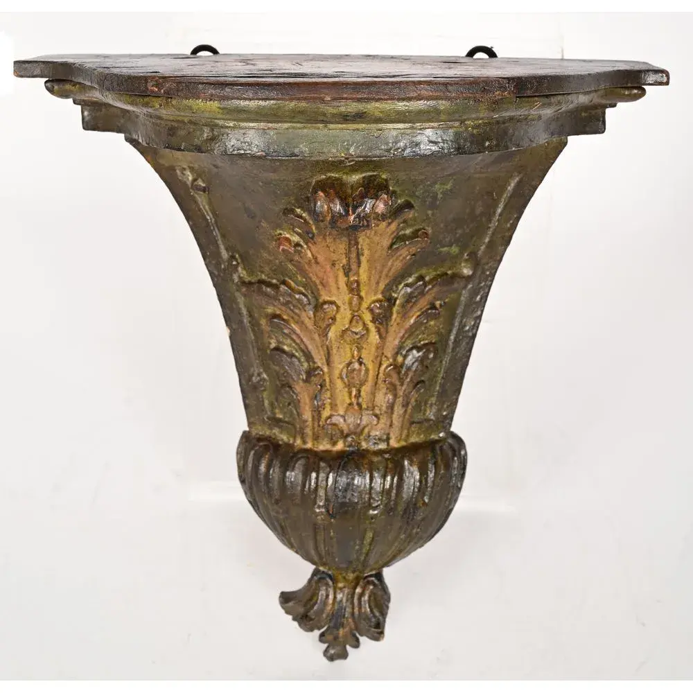 REGENCE WALL-MOUNTED CONSOLE TABLE in carved and patinated wood with
