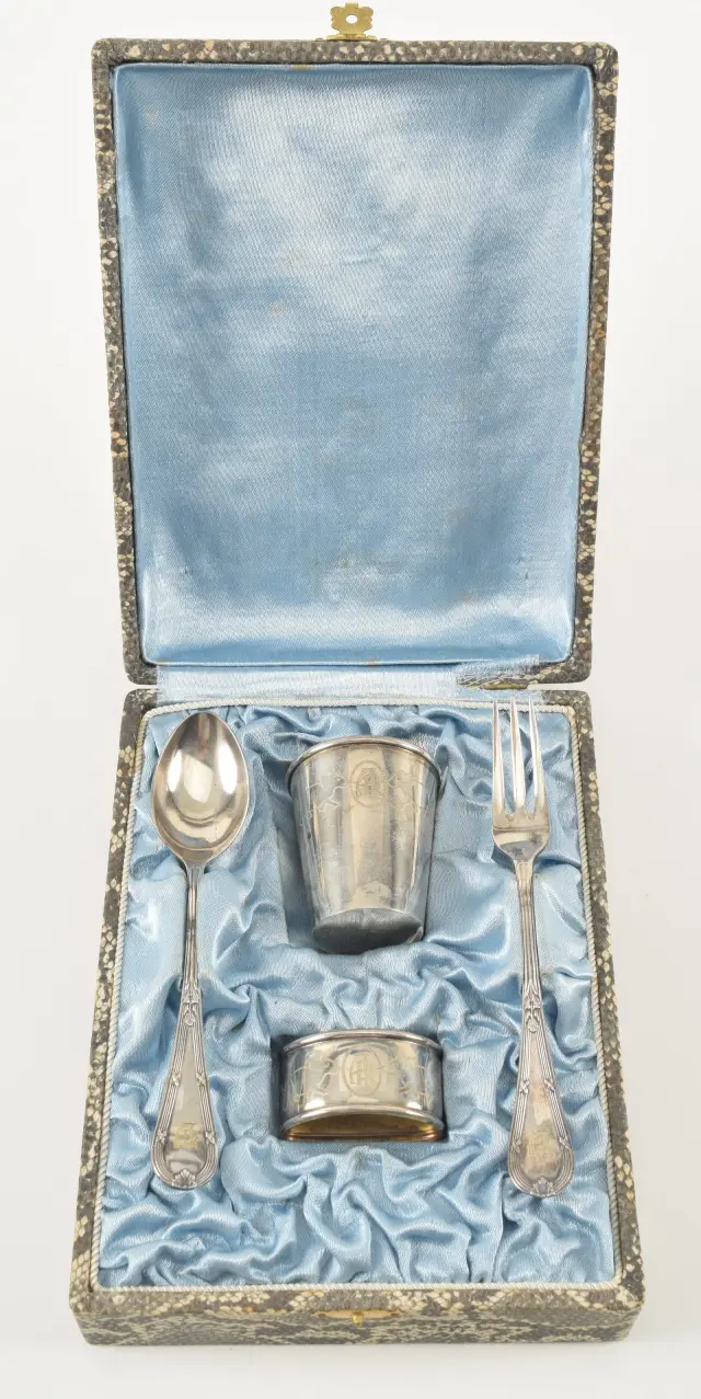 Antique child's set with silver cup and napkin ring. Engraved animal