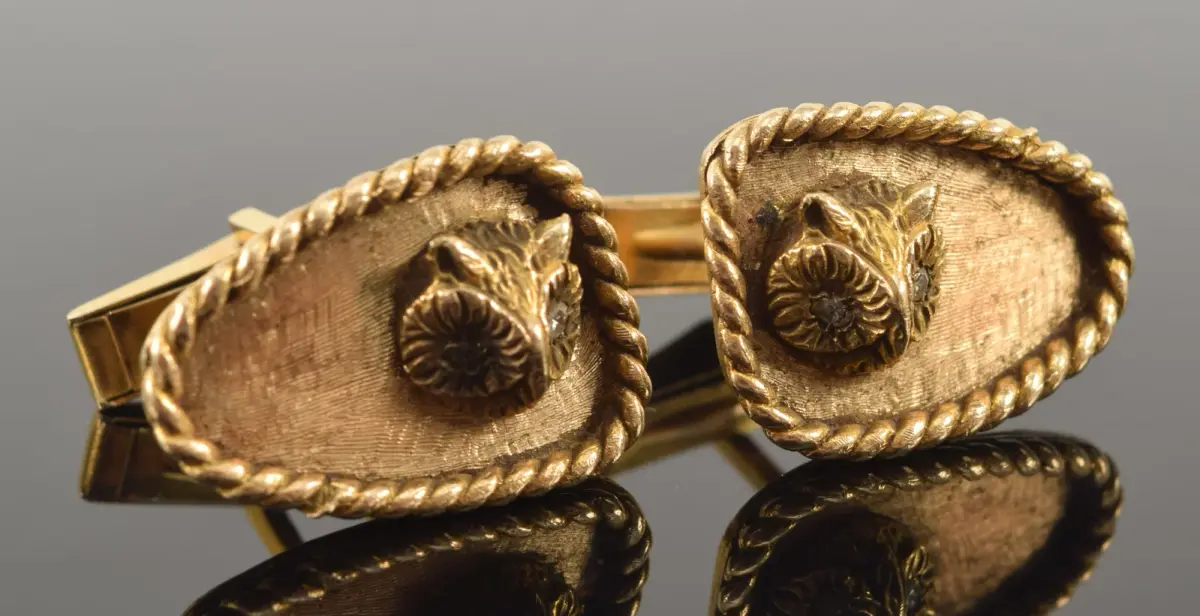 Vintage 14K gold owl head cufflinks. Braid bordered panels with the