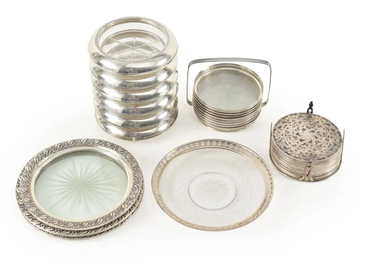 Collection of Sterling silver framed coasters, including a heavy set