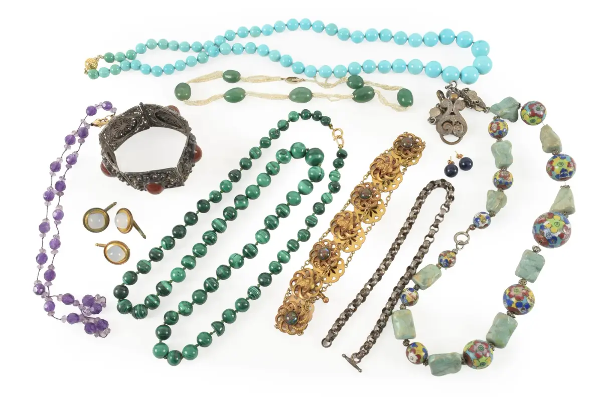 Assortment of antique and vintage jewelry, including silver segmented