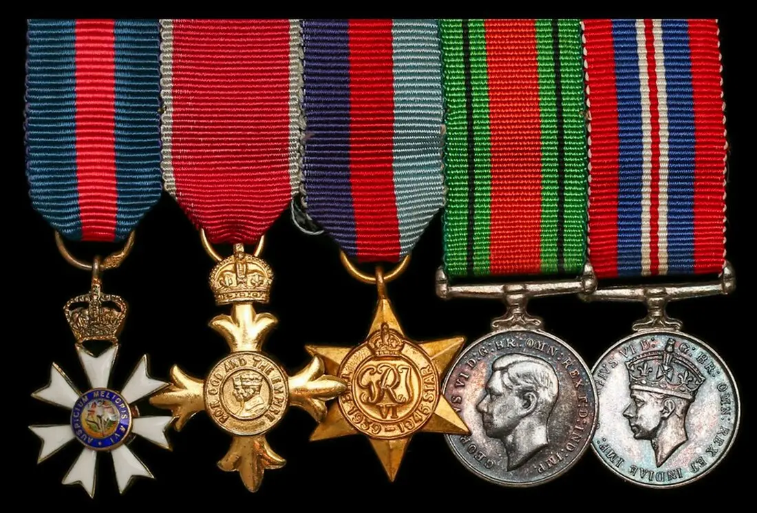 The mounted C.M.G., O.B.E. group of five miniature dress medals worn