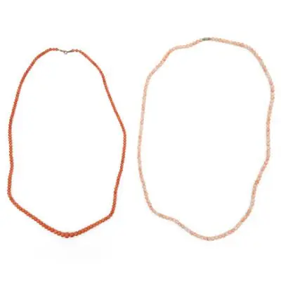 Two coral necklaces each set with numerous polished coral beads. Bead