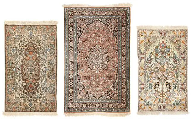Three Kasmir silk rugs, India. 158 x 94 cm. 186 x 116 cm. 149 x 87