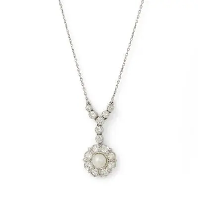 A pearl and diamond necklace set with numerous diamonds, mounted in