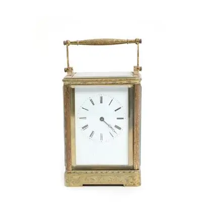 Valery Paris: French brass travel clock with richly engraved foliate