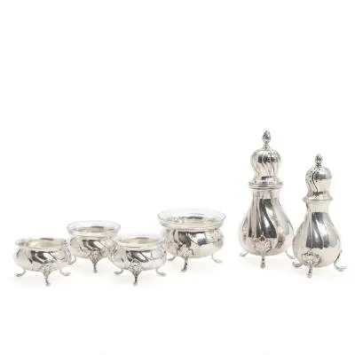 Four silver salt cellars and two pepper shakers. Cohr, Grann & Laglye