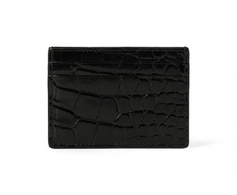 Gucci: A card holder of black crocodile skin and five card slots.
