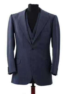 Alfred Alm: A three-piece business suit in mid-blue herringbone. 1984.