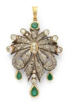 A diamond and emerald brooch/pendant set with diamonds and emeralds