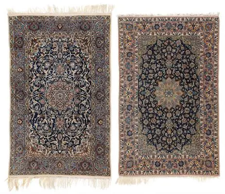 Two Persian Isfahan rugs. Medallion design on a blue field. 107 x