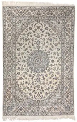A signed Nain rug, Persia. Medallion design. Knotted on silk warps.