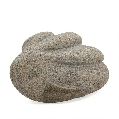 Flemming Holm: A partly polished granite sculpture in shape of a bird.