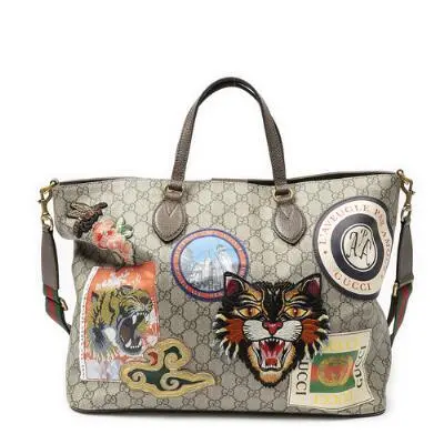 Gucci: A "Courrier Soft Tote" bag of brown monogram coated canvas