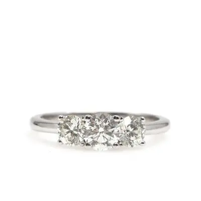 A diamond ring set with three brilliant-cut diamonds weighing a total
