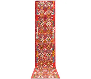 An Afghan kilim runner, c. 500 x 83 cm.
