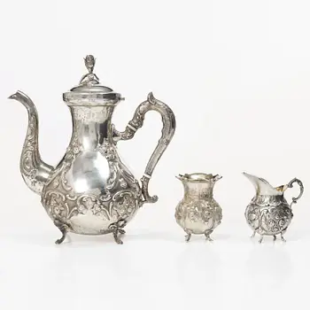 A silver Rococo style coffee pot, creamer and sugar bowl, Swedish