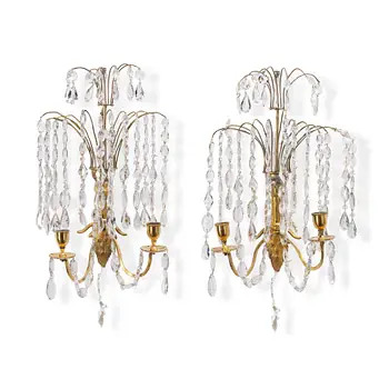 A pair of late Gustavian ormolu two-branch lustres, circa 1800.