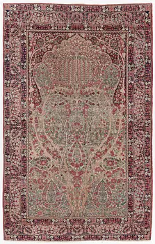 An antique Kirman rug, south Persia, c. 220 x 140 cm.