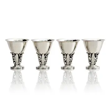 Evald Nielsen, four sterling silver beakers/cups on a foot, Denmark