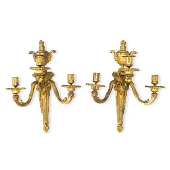 A pair of three-branch gilt brass Louis XVI-style appliques, circa 1900.