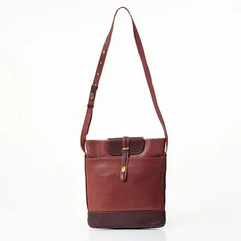Cartier, A red leather vintage bag.