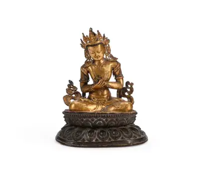 A large copper-gilt repousse figure of Vajradhara, Tibet, 15th or 16th century