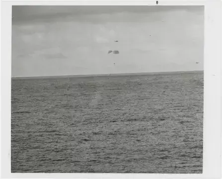[Apollo 13] THE CREW PARACHUTING SAFELY TO THE PACIFIC OCEAN AFTER