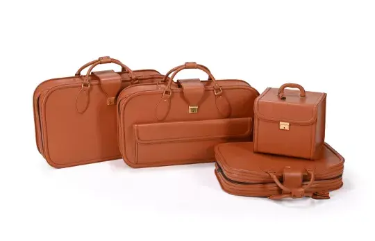 SCHEDONI FOR FERRARI , A FOUR PIECE TAN LEATHER LUGGAGE SET