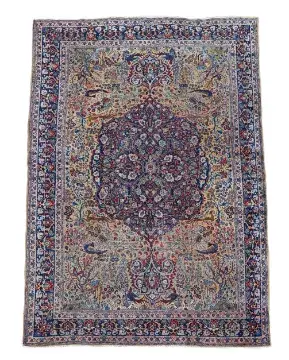 A TABRIZ CARPET, SIGNED BY MASTER WEAVER 'GHANADI', CIRCA 1890