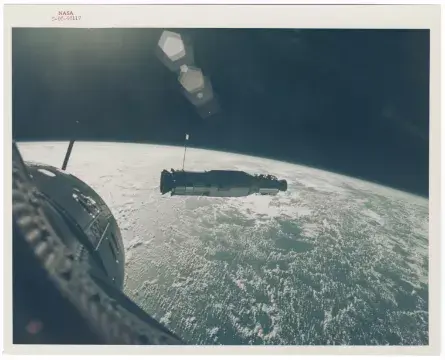[Gemini X] COVER OF LIFE: SUN-ILLUMINATED AGENA SET AGAINST THE CURVATURE