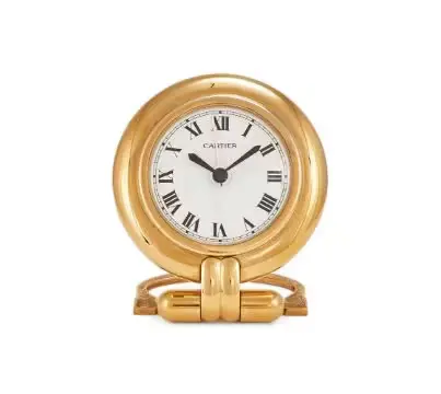 CARTIER, COLISEE, A GILT METAL TRAVEL DESK ALARM CLOCK