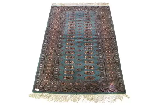 A vintage Bokhara rug.