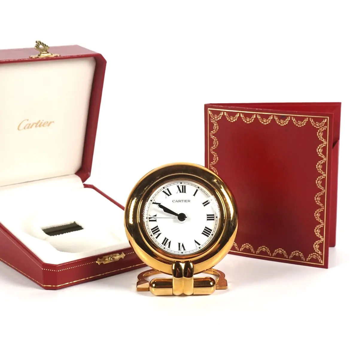 CARTIER : Pendulette - réveil modèle "Colisée" en métal doré