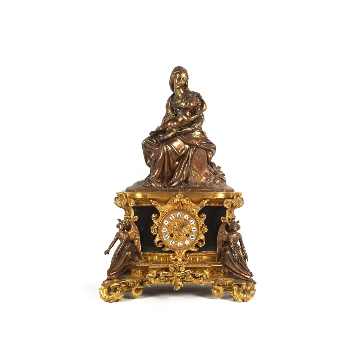 Pendule à poser en bronze doré et médaille