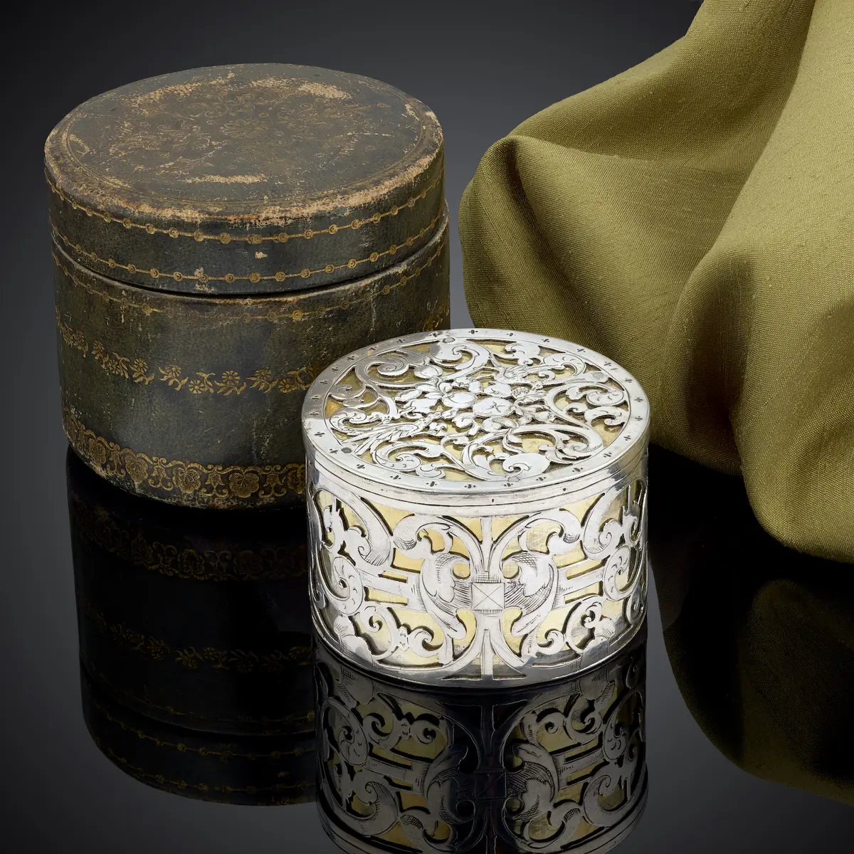 A circular strapwork Box, silver and parcel gilt, Dutch c.1660